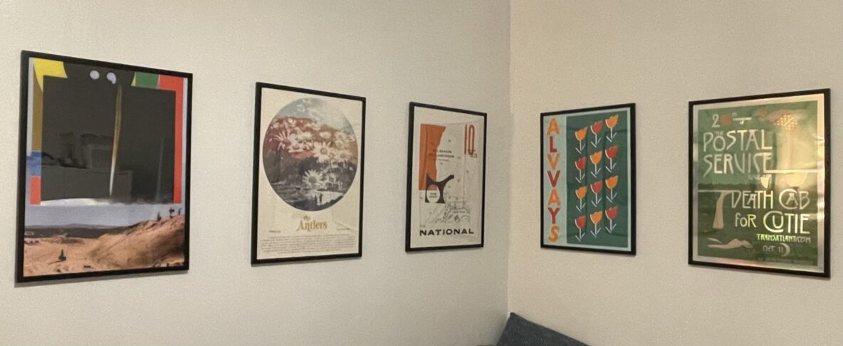 5 framed posters on a wall